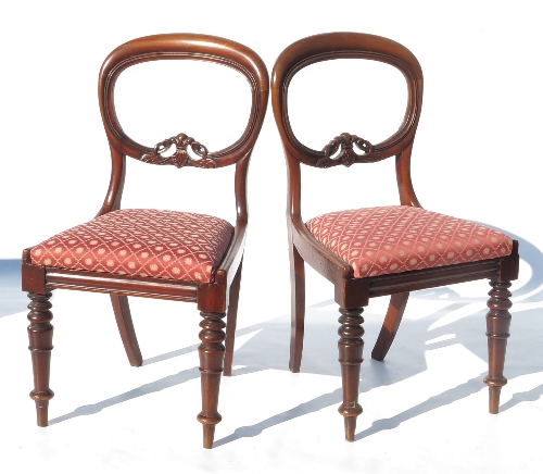 A harlequin set of eight 19th mahogany balloon back dining chairs,