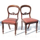 A harlequin set of eight 19th mahogany balloon back dining chairs,