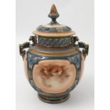 A Hadleys Worcester covered vase, decorated with sepia panels of foliage,