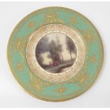 A Royal Worcester plate, decorated with a Corot scene by H Davis, to a green and gilt ground,