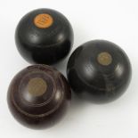 A collection of fourteen bowling balls, to include ten lignum vitae bowls, circa 1920/30's,
