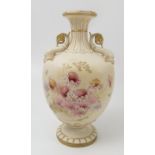 A Royal Worcester gilded ivory vase, decorated with flowers, with dolphin handles,