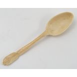 A 19th century carved ivory spoon, with wheat motif to the finial, length 7.