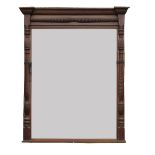 A large mahogany framed mirror, flanked by reeded and turned half columns,