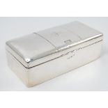 A silver cigarette box, of rectangular form, the lid engraved with a J, Sheffield 1910,