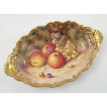 A Royal Worcester oval dish, hand painted with fruit to a mossy background by H Ayrton,