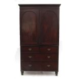 A 19th century mahogany linen press,