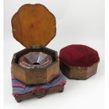 A pair of octagonal walnut veneered boxes, with upholstered lids,