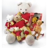 A large Rupert Bear, together with three others, to include a 75th Anniversary Bear,