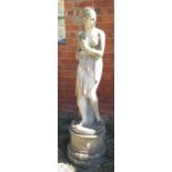 A reconstituted figure, of a semi-draped girl, raised on a pedestal,