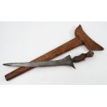 A Malay dagger, in hardwood scabbard,