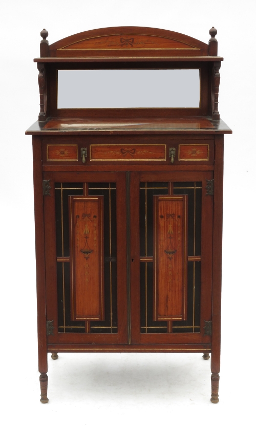 An Aesthetic movement cabinet, with mirror back and shelf under,