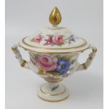 A Royal Crown Derby covered vase, decorated with flowers to a white ground,