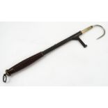 A 19th century telescopic fishing gaff, with turned wooden handle,