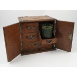 A late 19th century oak smokers companion,