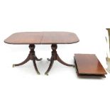 A mahogany twin pillar dining table, of D-shape form,