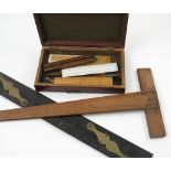 A collection of drawing instruments, to include rulers, folding rulers, brass dividers, compasses,