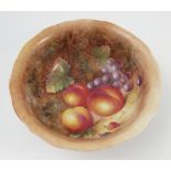 A Royal Worcester bowl, the interior decorated with fruit to a mossy background by J Cook,