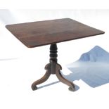 A 19th century rectangular oak occasional table, raised on a tripod base,