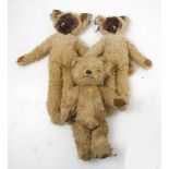 A Merrythought gold plush teddy bear, with stitched features,