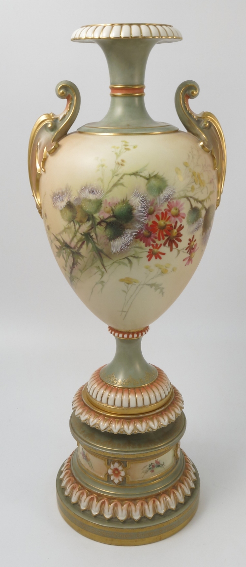 A Royal Worcester blush ivory pedestal vase, decorated with thistles and flowers,