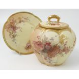 A Royal Worcester blush ivory covered cracker barrel and stand, decorated with flowers,