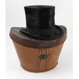 A leather covered top hat box, with leather strap,