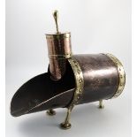 A 19th century Arts and Crafts copper and brass coal scuttle, together with matching shovel,