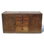 A Betty Joel sideboard, fitted four short central drawers, flanked by two cupboards,