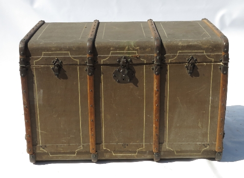 A late 19th century motoring trunk, opening to reveal a fitted interior with drawers,