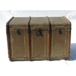 A late 19th century motoring trunk, opening to reveal a fitted interior with drawers,