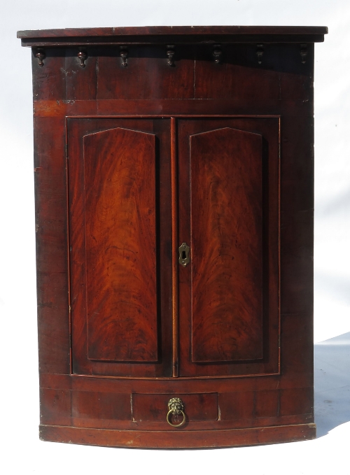 A 19th century mahogany bow front corner cupboard,