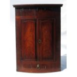 A 19th century mahogany bow front corner cupboard,