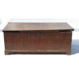 A 19th century oak chest, of rectangular form, fitted with a candle box,