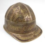 A brass miners helmet,