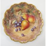 A Royal Worcester cabinet plate, decorated with fruit to a mossy background by H Ayrton,