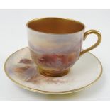 A Royal Worcester cabinet cup and saucer,