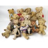 Seventeen various gold plush teddy bears,