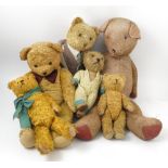 Six gold plush teddy bears,