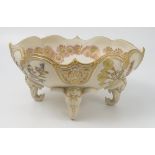 A Royal Worcester gilded ivory centre piece, of shaped oval form,