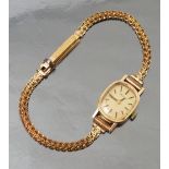 A ladies Bulova 9ct gold wrist watch, on a bracelet, weight 9.