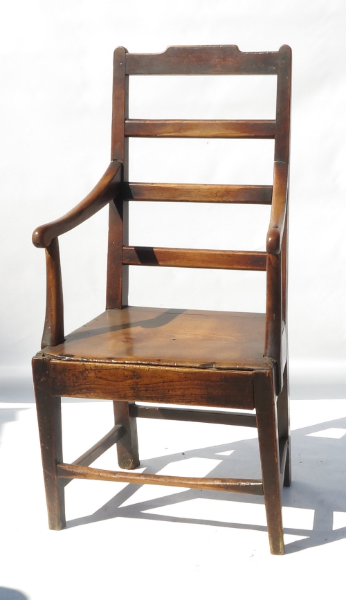 A 19th century country ladder back armchair,