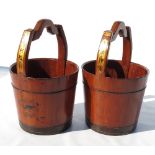 Two similar painted Chinese rice buckets, with character symbols,