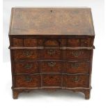 A 19th century Dutch style marquetry bureau, having foliate marquetry decoration to the whole,