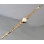 A Rotary ladies 9ct gold bracelet watch, London 1963, to an integral gate link bracelet,