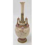 A Royal Worcester gilded ivory vase, decorated with flowers and well moulded in lilac and mauves,