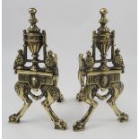 A pair of 19th century cast brass neo-classical Adams style fire dogs,