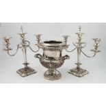 A silver plated campana shaped urn, with flower, leaf and gadrooned decoration,