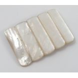 A mother of pearl belt buckle, of rectangular form with ribbed decoration, 3.25ins x 2.