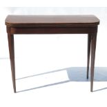 A 19th century mahogany fold over tea table, of D-shape, with cross banded ebonised top,